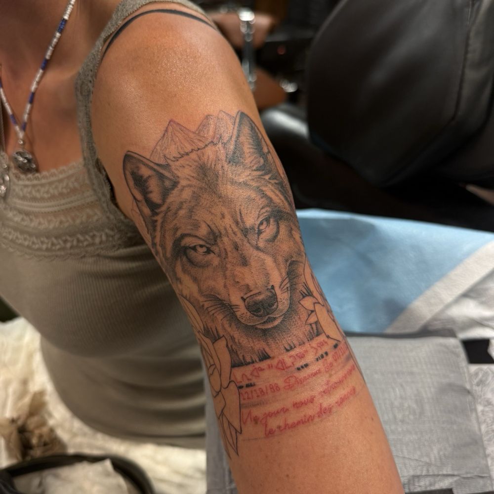 Firma Tattoo - Wolf tattoo with Quebecois and Inuktitut writing in dedication to missing sister. - Tattoo Near Me - La Mesa, California Firma Tattoo - Wolf tattoo with Quebecois and Inuktitut writing in dedication to missing sister. - Tattoo Near Me - La Mesa, California