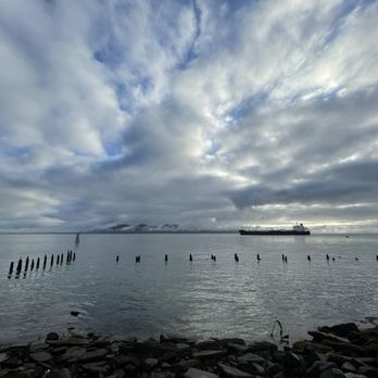 Astoria Riverwalk - Columbia River at Astoria. A ship anchored Washington's Wilipa Hills as a backdrop. Just a slice of the Riverwalk experience. - Hiking Near Me - Astoria, Oregon