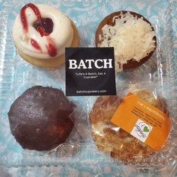Variety of paleo cupcakes and a cookie Variety of paleo cupcakes and a cookie