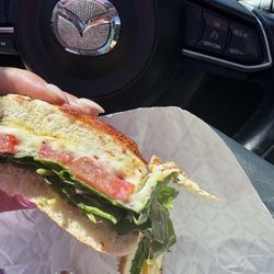 Indulge Coffee & Sandwich - Spinach and egg sandwich on an Asiago bagel.