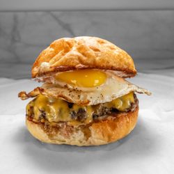 Georges Burger. 4 oz black angus beef patty with american cheese and a sunny side up egg.