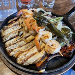 Parrillada platter. Pay attention to that hidden pork chop as it is the star of the dish. Missing a guacamole Parrillada platter. Pay attention to that hidden pork chop as it is the star of the dish. Missing a guacamole