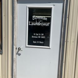 Bowman Laundromat - Front door with information.