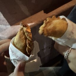 mini empanada while waiting for a table