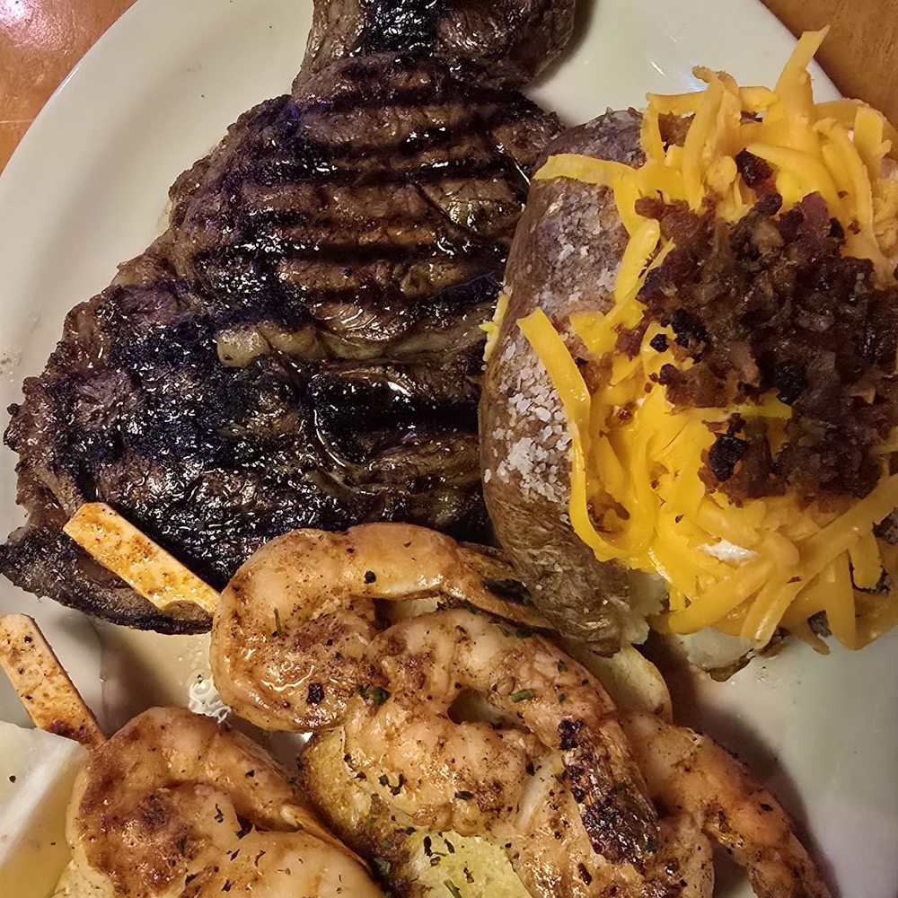 Texas Roadhouse - Rybeye with grilled shrimp and a side baked potato - Steakhouses Near Me - New Braunfels, Texas Texas Roadhouse - Rybeye with grilled shrimp and a side baked potato - Steakhouses Near Me - New Braunfels, Texas