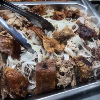 Sandy's Cuban Cafe - Pork with crispy skin at the display case. Didn't try tho but will do so next time - Cuban Near Me - Naples, Florida