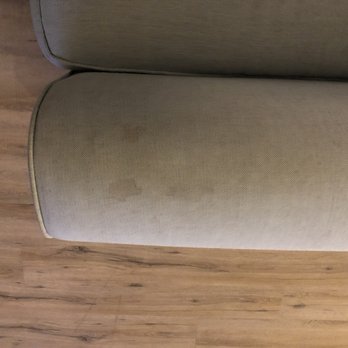 Treasure Realty - Couch arm - Property Management Near Me