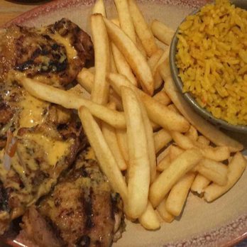 Nando's - Chicken thighs with medium sauce, peri salted chips, and spicy rice - Chicken Shop Near Me - Gatwick, WSX