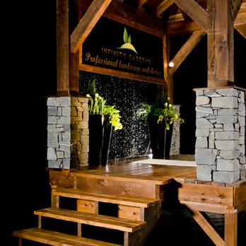 Infinity Gardens - an outdoor hot tub with a waterfall - Landscaping Near Me Infinity Gardens - an outdoor hot tub with a waterfall - Landscaping Near Me