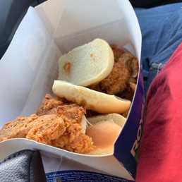a basket of fried chicken and bread