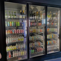 Next Door Beer Bar & Bottle Shop - Can and bottle refrigerator