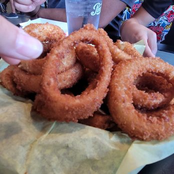Hodad's - 1/2 Frings comes with 14 onion rings over a bed of potatoes wedge fries. $12.50. - Burgers Near Me - San Diego, California Hodad's - 1/2 Frings comes with 14 onion rings over a bed of potatoes wedge fries. $12.50. - Burgers Near Me - San Diego, California