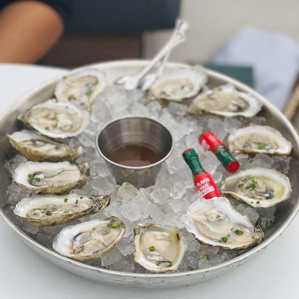 Catbird - Oysters $3 each. Served with rose mignonette and mini Tabasco bottles, how cute! - Tapas/Small Plates Near Me - Dallas, Texas