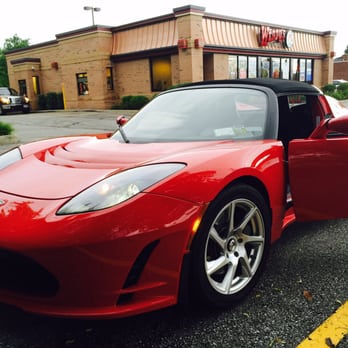 Wendy's - a red sports car parked in a parking lot - Burgers Near Me - Richmond Heights, Ohio
