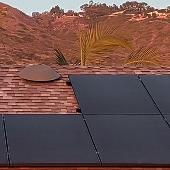 NexGen Construction - Solar panels, no grid lines. Sunset time makes roof appear reddish - Solar Installation Near Me - Los Alamitos, California NexGen Construction - Solar panels, no grid lines. Sunset time makes roof appear reddish - Solar Installation Near Me - Los Alamitos, California