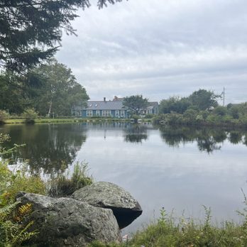 Blueberry Hill Inn - A view of the inn on the other side of the pond. - Bed & Breakfast Near Me - Goshen, Vermont