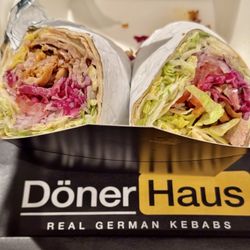 Döner Wrap: (chicken + beef), lettuce, tomato slices, red onions, & red cabbage with yogurt herbed white sauce
