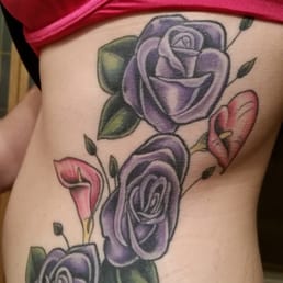 Three roses in honor of my grandfather who had recently passed, the color purple in honor of my grandmother. Three roses in honor of my grandfather who had recently passed, the color purple in honor of my grandmother.