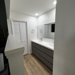 AFTER:  Master Vanity with shower room bifold door