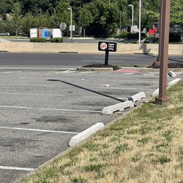 Trash not picked up ! No trash bins in parking lot!