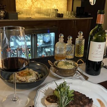14 Prime - Ribeye steak with roasted garlic and side of Aligot potatoes - Steakhouses Near Me - Jacksonville, Florida