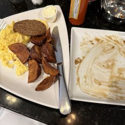 Delicious Eggs potatoes and turkey sausage with banana bourbon French toast
