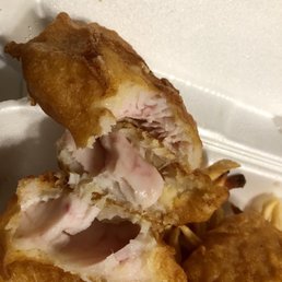 Fish and chips are still partially raw and pink in the middle. Fish and chips are still partially raw and pink in the middle.