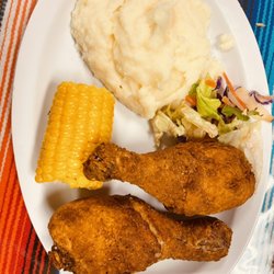 Mona’s Kitchen - Chicken drumstick platter mashed potatoes corn and a side salad