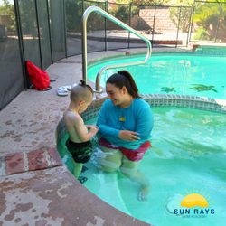 Sun Rays Swim Academy - Instructor Tatev comforting her student during class time!