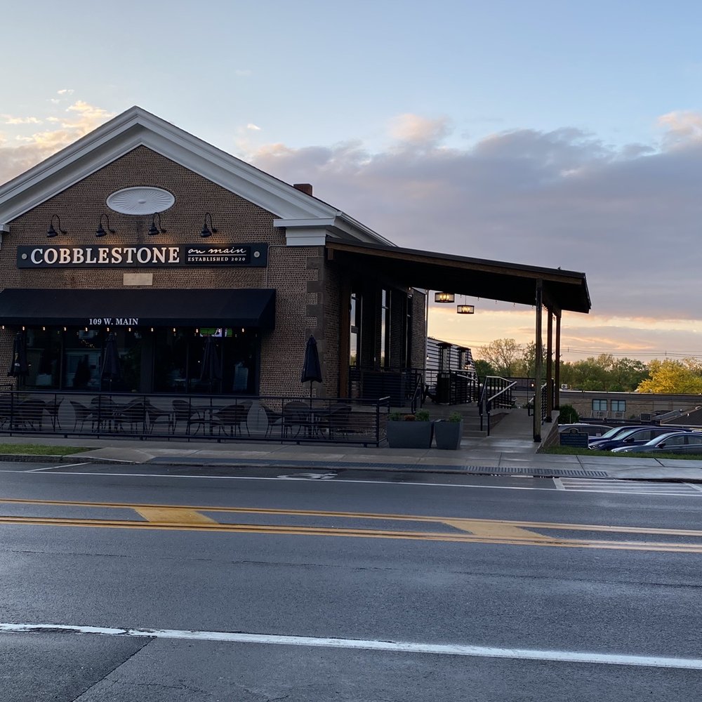 Outside view; parking on the street is available (one spot in front is handicapped) also a lot on the right side of the building.