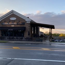 Cobblestone On Main - Outside view; parking on the street is available (one spot in front is handicapped) also a lot on the right side of the building.