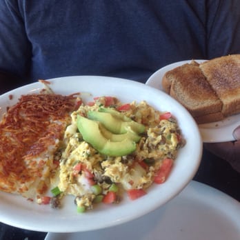 Chelly's Cafe - Egg scramble with pepper jack cheese, onions, tomatoes, hamburger meat topped with avocados!!! Yummy! Hash browns wheat toast - Cafes Near Me - Palmdale, California