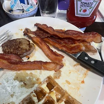 Eddie's Diner - Chicken fried chicken what's left of it lol with side bacon and sausage patty and a piece of Belgian waffle. - Breakfast & Brunch Near Me - Plano, Texas Eddie's Diner - Chicken fried chicken what's left of it lol with side bacon and sausage patty and a piece of Belgian waffle. - Breakfast & Brunch Near Me - Plano, Texas