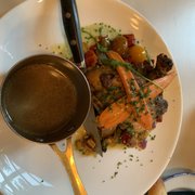 Photo of Kendall's Brasserie - Los Angeles, CA, United States. SEARED CHICKEN BREAST* 36.0 CORN AND PEPPER SUCCOTASH, CARROTS, CHERRY TOMATO, ARUGULA, HERB MORNAY SAUCE, CHICKEN JUS