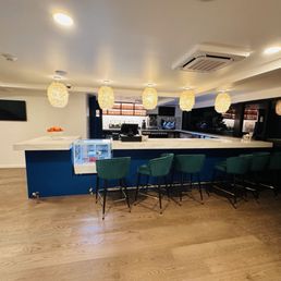 Downstairs bar with outdoor pool bar service window Downstairs bar with outdoor pool bar service window