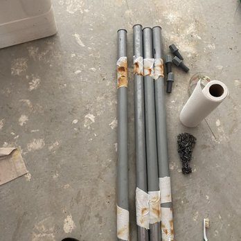 StorageMart - Trying to remove rust from the legs of a stainless steel prep table by soaking it in vinegar - Self Storage Near Me - Athens, Georgia