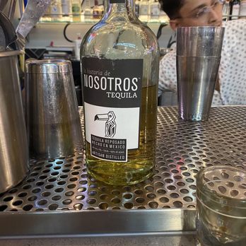 Rodeo Bar - a bottle of liquor on a bar counter - Cocktail Bars Near Me - Stanton, California