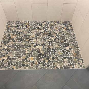 Orcino Tile - Pebble shower floor tile with inset drain. - Tiling Near Me Orcino Tile - Pebble shower floor tile with inset drain. - Tiling Near Me