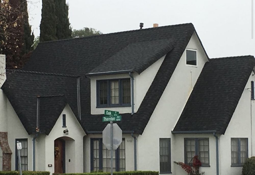 Slide of Exclusively Roofing