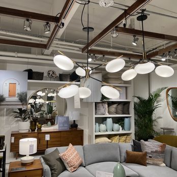 Williams-Sonoma - a living room with a large sectional couch - Kitchen & Bath Near Me - Miami Beach, Florida Williams-Sonoma - a living room with a large sectional couch - Kitchen & Bath Near Me - Miami Beach, Florida