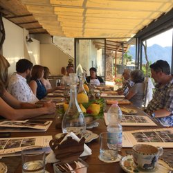 Mamma Agata - Long wood table on the patio - Chiara is sitting at the head of the table across from me
