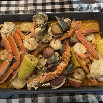 The Boil Shack - Dinner special 1/2 lb king crab, 1/2 lb snow crab, 1 lb shrimp, potatoes sausage and corn. Added 12th out Raw top neck clams - Seafood Near Me - Albany, New York