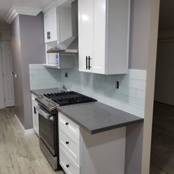 Lilias Kitchen and Tile - New stove and range, along with new cabinets, countertop, tile and flooring