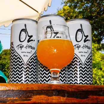 Oz. Tap House - three cans of beer on a table - Beer Gardens Near Me - Austin, Texas Oz. Tap House - three cans of beer on a table - Beer Gardens Near Me - Austin, Texas
