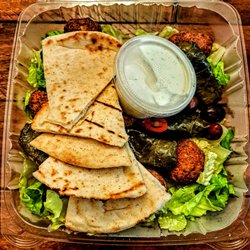 Yianni's Cafe - STUFFED GRAPE LEAVES AND FALAFEL COMBO: Served with tzatziki and Pita Bread. $13