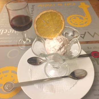 Restaurant de l'Evêché - Ice cream with a dehydrated sugared orange garnish. - Cafes Near Me - Lausanne, VD