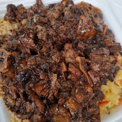 Golden Krust - #6. Braised Oxtail Combo oxtails, cabbage and rice and beans