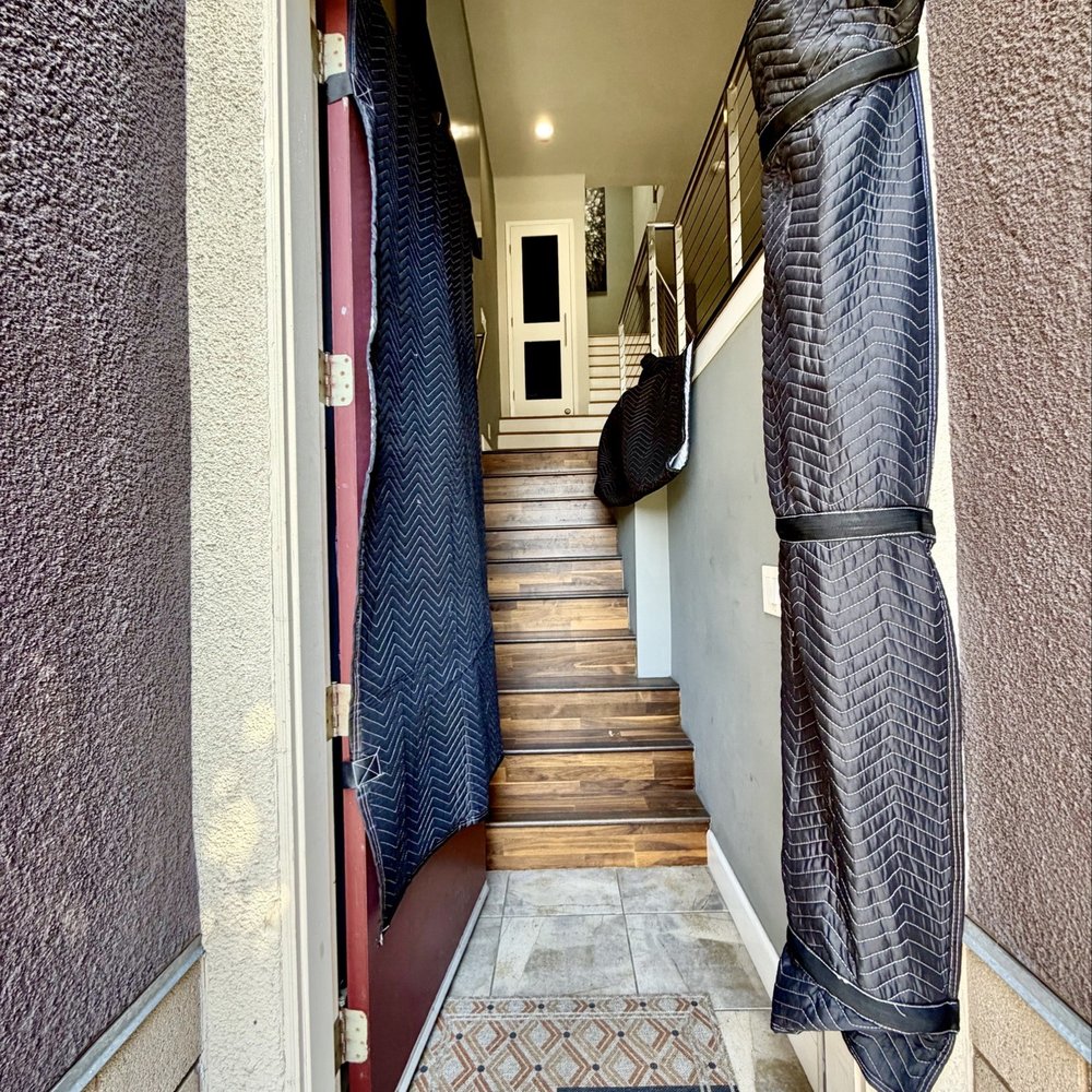 Just Move It - Wrapped the narrow stairway in blankets to avoid bumps! - Movers Near Me - San Diego, California Just Move It - Wrapped the narrow stairway in blankets to avoid bumps! - Movers Near Me - San Diego, California