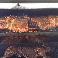 Jt's Seafood - Whole pigs on our huge pit