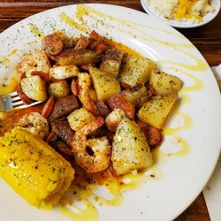 Busy Bee's Kitchen - Bourbon Shrimp with corn, potatoes, smoked sausage, and yes an extra side of loaded mashed potatoes